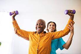 Senior with Parkinsons using weights