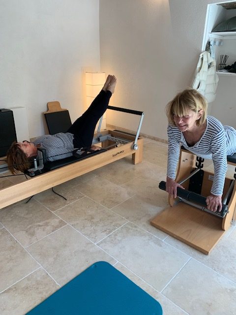 women using Pilates equipment