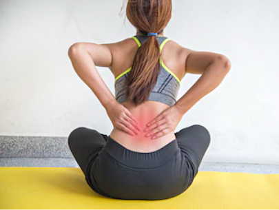 Lady with red inflamed back muscles